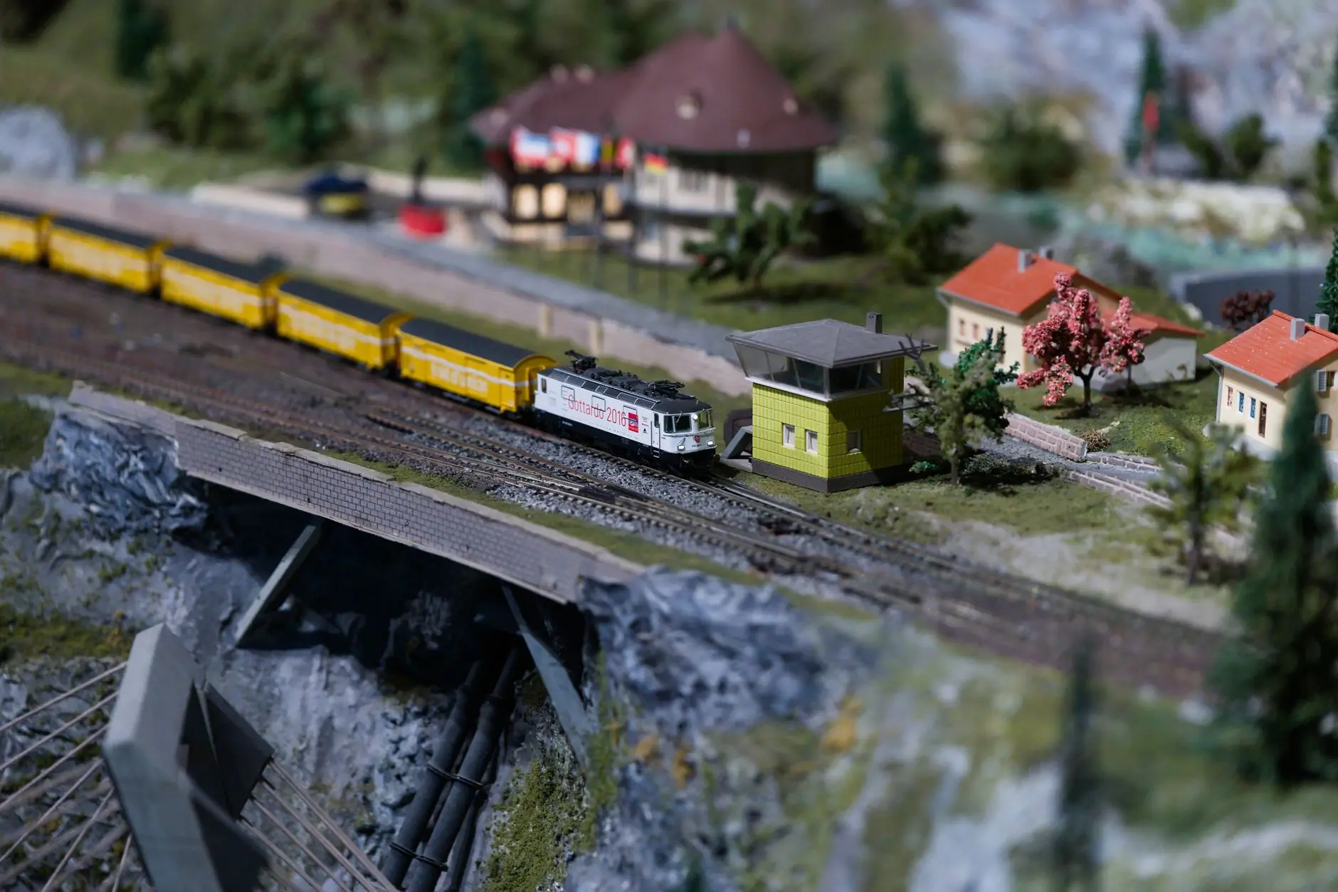 A close-up photo of a detailed miniature cityscape diorama with tiny buildings and streets