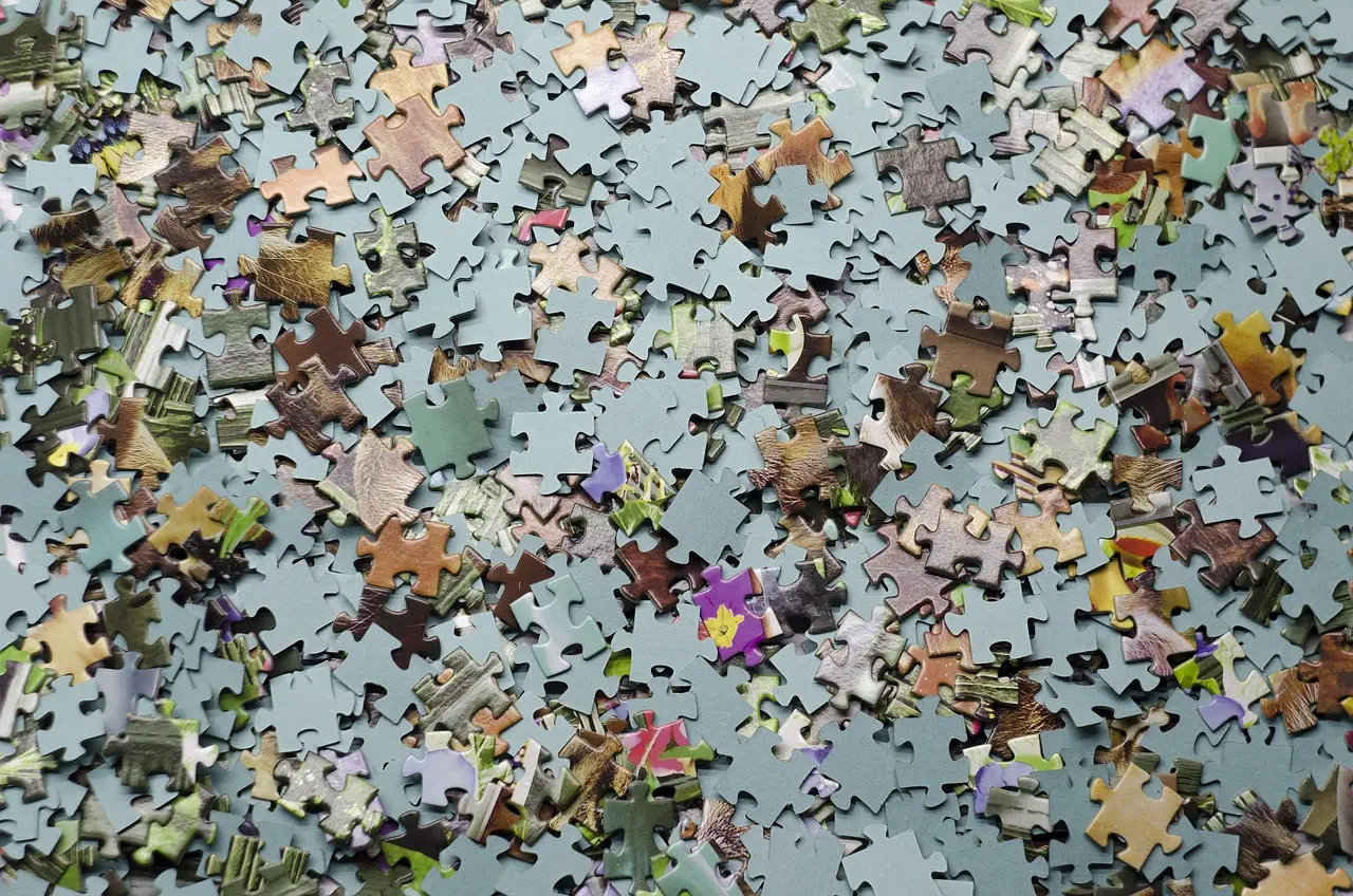 Close-up of several interlocking puzzle pieces fitting together neatly